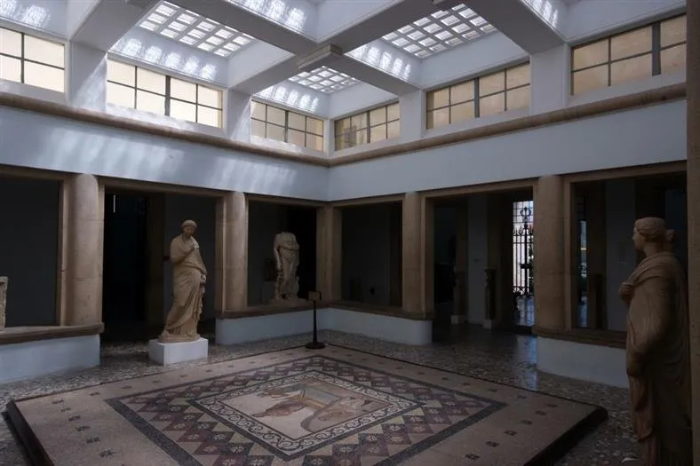 Atrium of the Archaeological Museum of Kos with statues and a floor mosaic